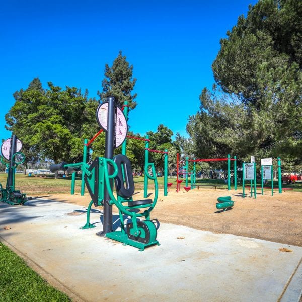 Exercise equipment among grass and trees