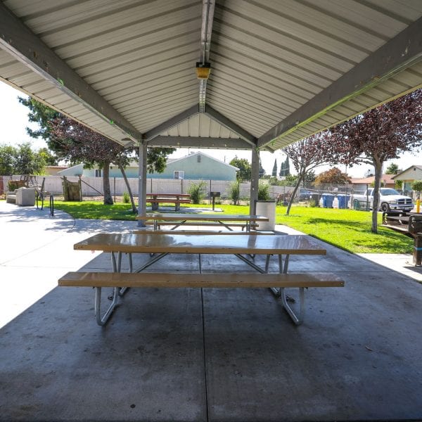Picnic tables under an awning