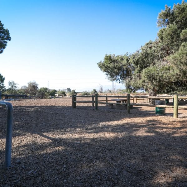 Fenced off equestrian track with a hitching post