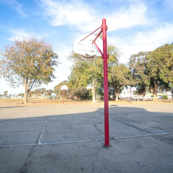 Basketball courts with hoops on red posts