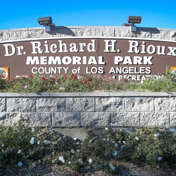 Dr Richard H Rioux Memorial Park sign
