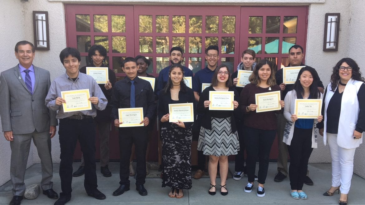 Group photo. Students holding certs