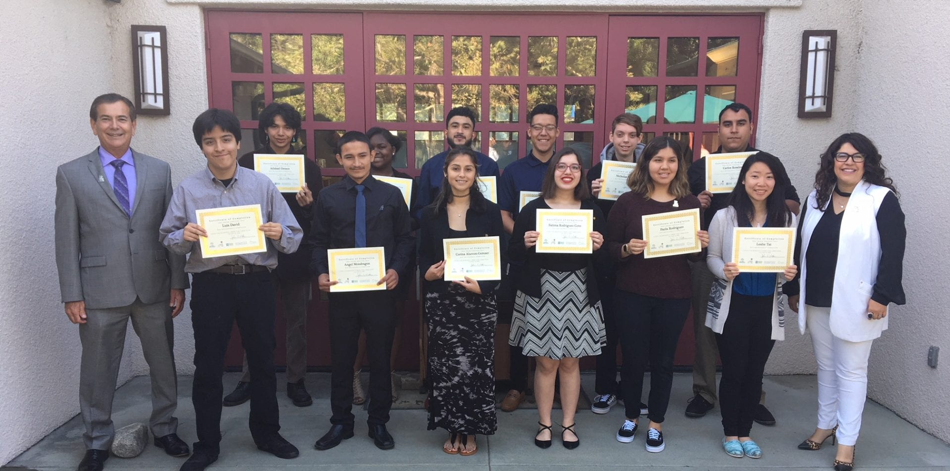 Group photo. Students holding certs