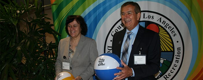 park and recs director with woman holding beach balls