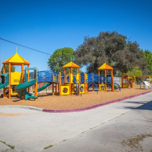 Chain of playgrounds, benches to the right