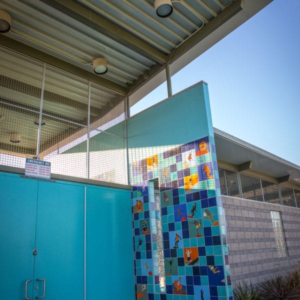 Colorful tile wall on pool building
