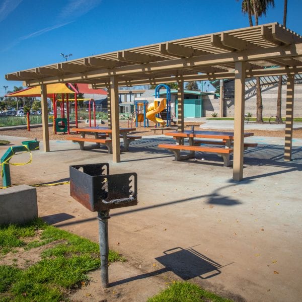 BBQ grills, awning over picnic tables and playground