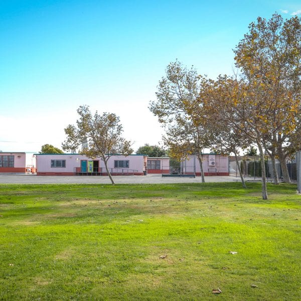 Grass field and classrooms