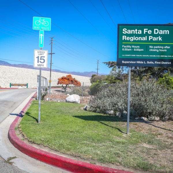 Santa Fe Dam Recreational Area sign to the right side of a road
