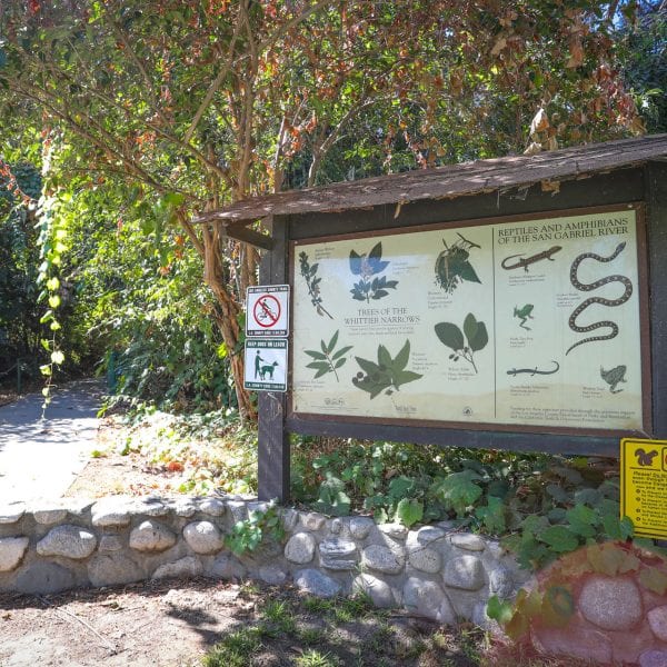 Informational sign next to garden walkway