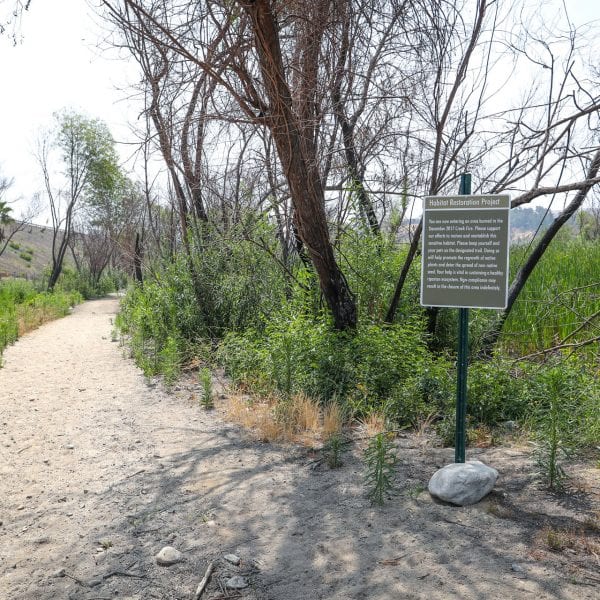 Habitat Restoration Project sign aside a trail
